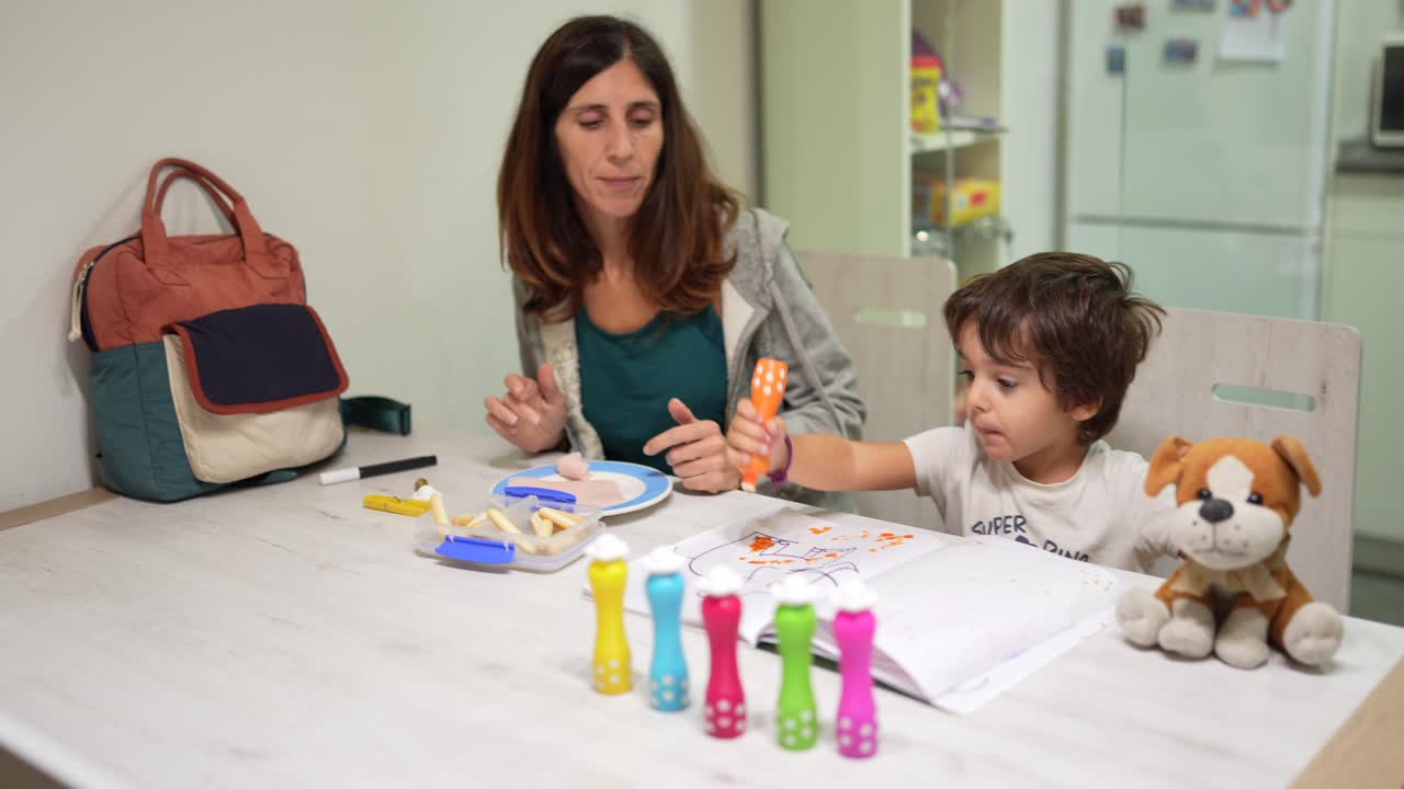 Mother and Child Drawing at Table
