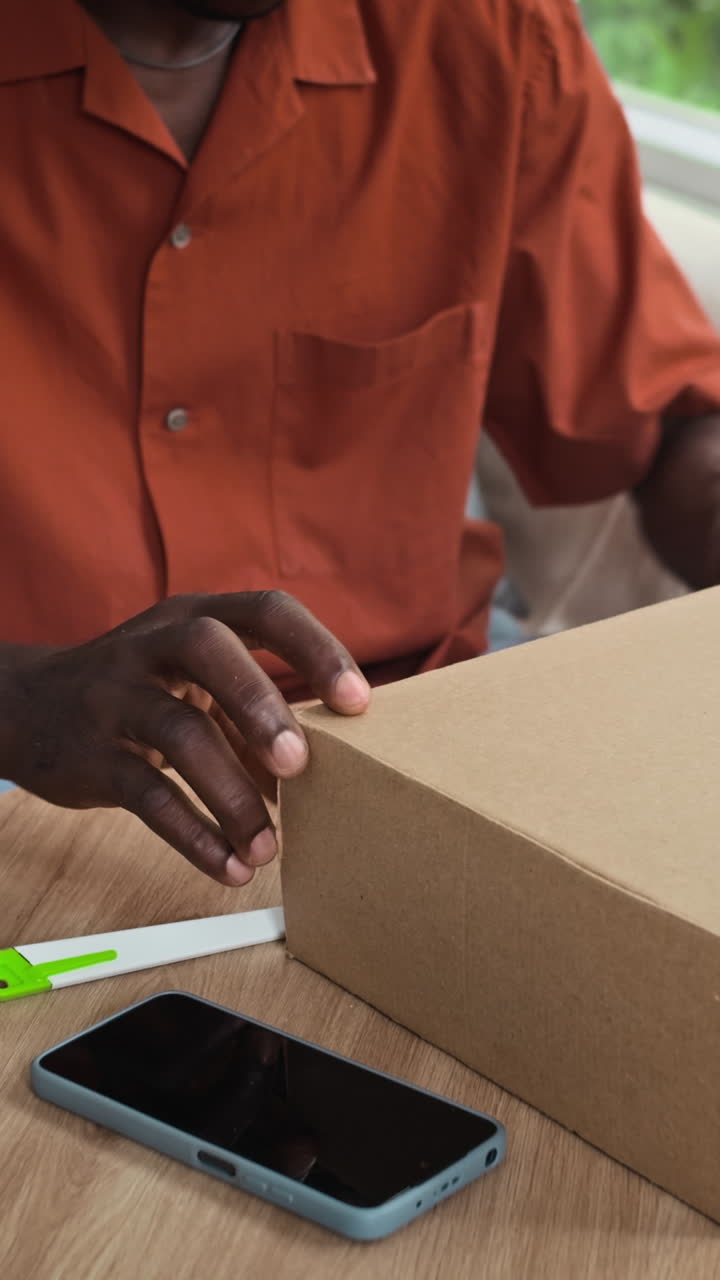 Vertical of Man Checking Loafers in Parcel