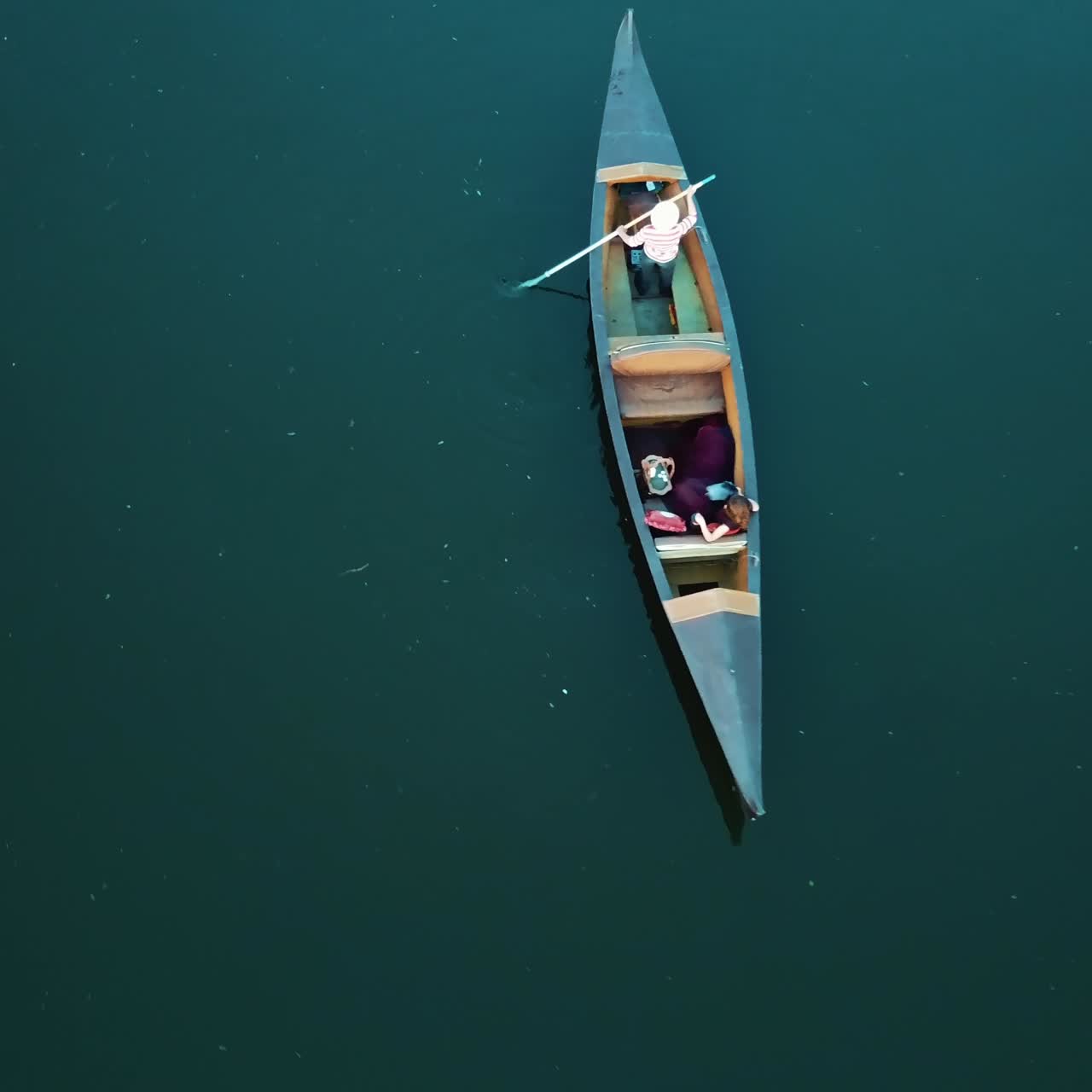 gondolier is floating on the Grand Canal in Venice with a tourist. Aerial view