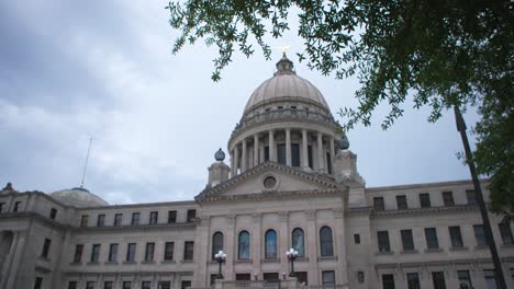 rack focus, wide: stormy skies over the mississippi state capitol building. jackson, ms
