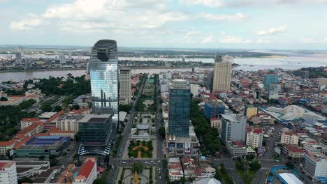 phnom penh's modern skyline with the tonle sap river in the background, aerial view