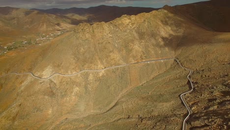 aerial view of the winding mountain road between two villages of fuerteventura.