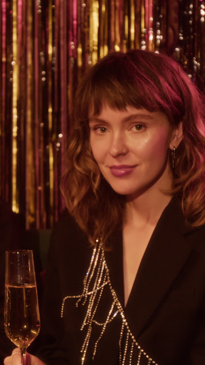 Woman celebrating with champagne at a festive event
