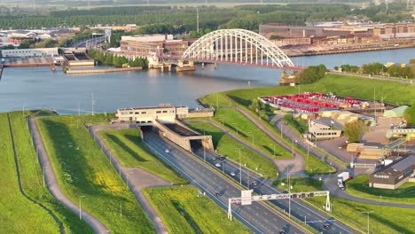 aerial view of a15 motorway ridderkerk beside crezeepolder and brug over de noord in background during golden hour