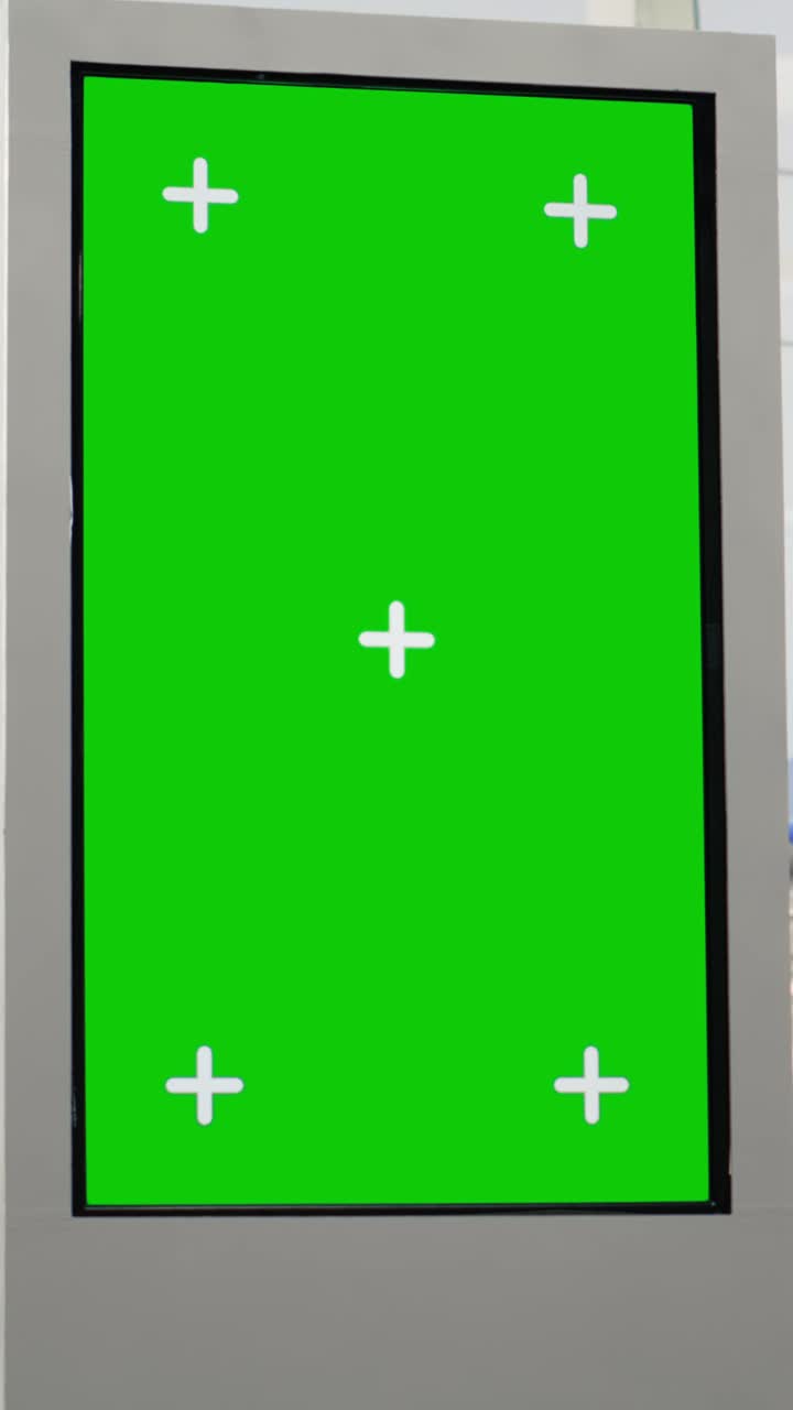 Vertical Video Green screen board in empty airport terminal with runway shown on big windows