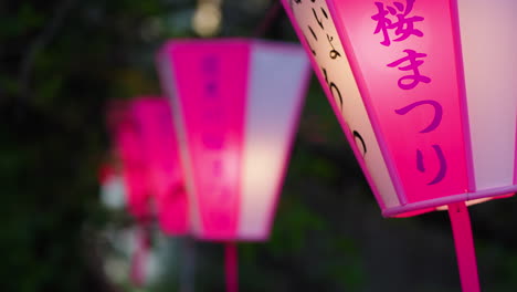 Slow-motion-bokeh-shot-of-Chinese-lanterns-with-writing-flickering-at-night