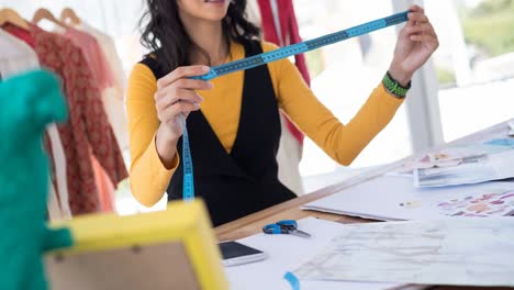 animation of female fashion designer working in fashion studio