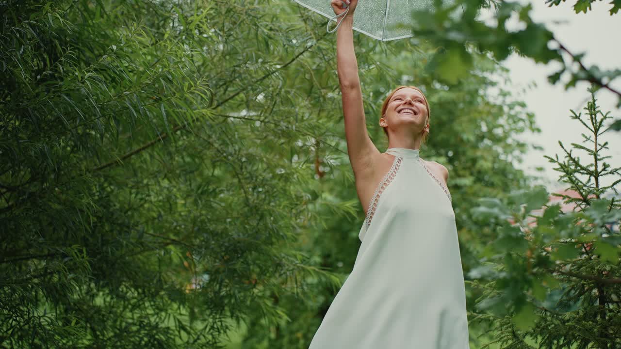 Woman enjoying a rainy day in nature