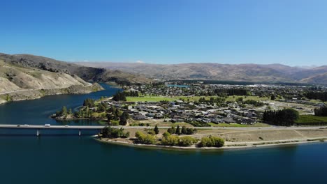 aerial view of cromwell, new zealand idyllic small town by clutha river and lake dunstan, central otago