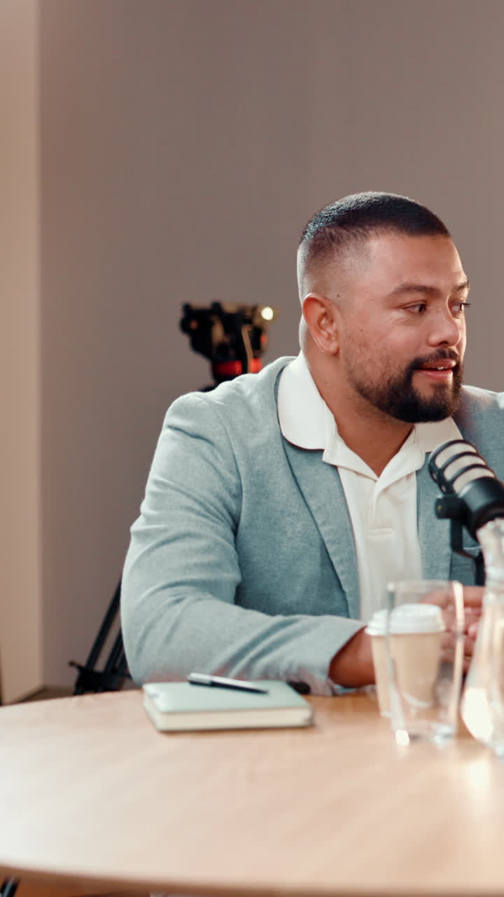 Podcast recording in studio with man speaking into microphone