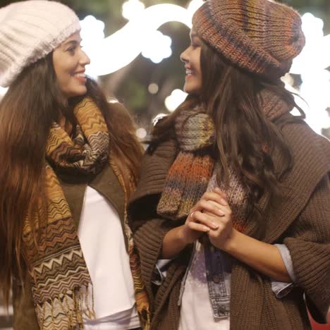 two young woman enjoying a winter night out