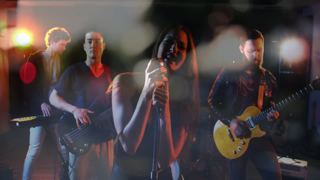 Band performing under warm stage lights, featuring animated sound wave overlays for music marketing