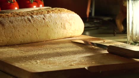 Hands-slice-loaves-of-bread