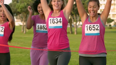 cheering women winning breast cancer marathon