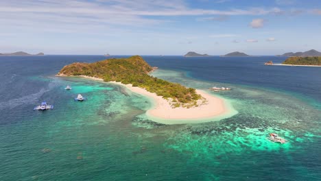 bird's-eye survey of manlihan island, stunning paradise with tranquil water in linapacan, philippines