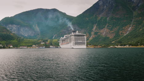 A-Huge-Ocean-Liner-Is-Moored-Off-The-Coast-Of-The-Picturesque-Norwegian-Fjord-4k-Video