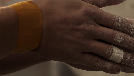 rock climbing hands with wristbands