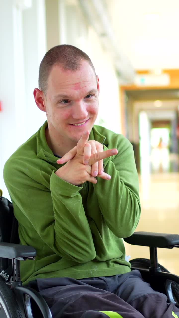 Man in wheelchair smiling