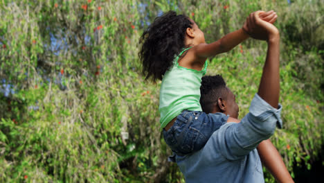 Father-holding-his-daughter-and-turning-round