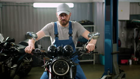 Young-man-with-cap-riding-at-the-garage