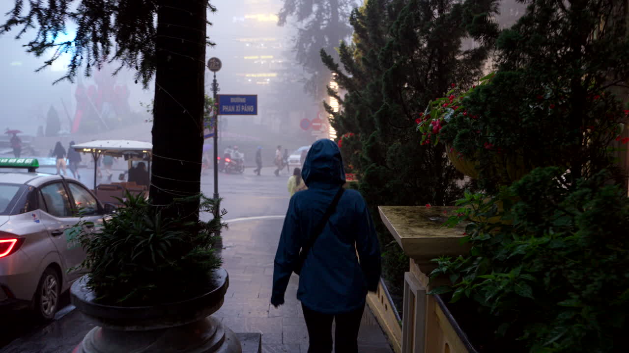 Urban rainfall, rickshaw transportation, Street corner location