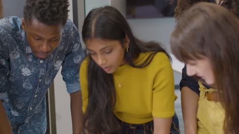 business colleagues brainstorming together around table