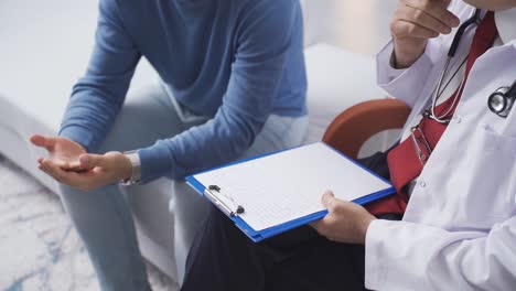 psychiatrist man at home in psychotherapy session with his male patient.