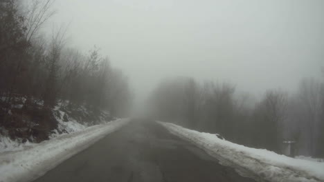 a car moves along a mountain road