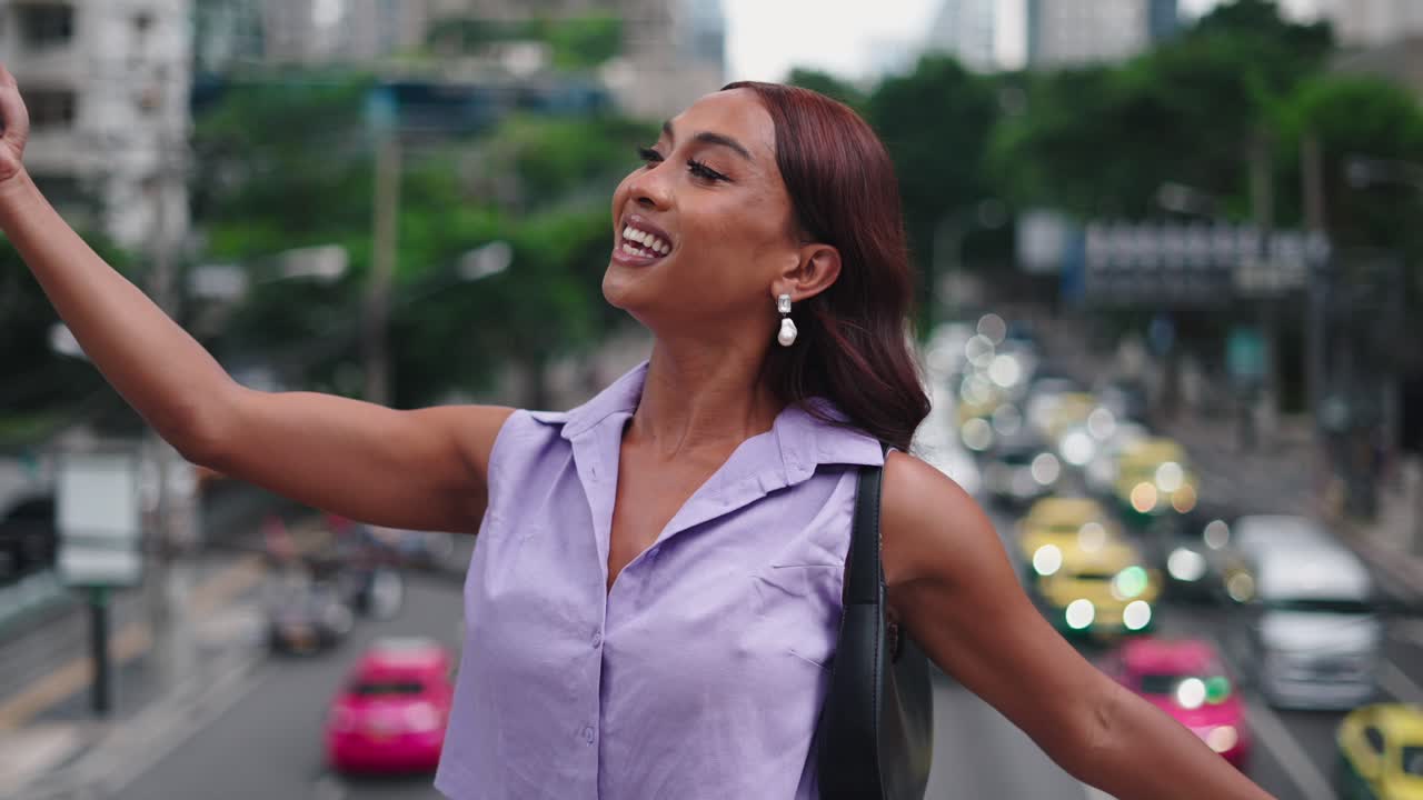 Woman in city using mobile phone