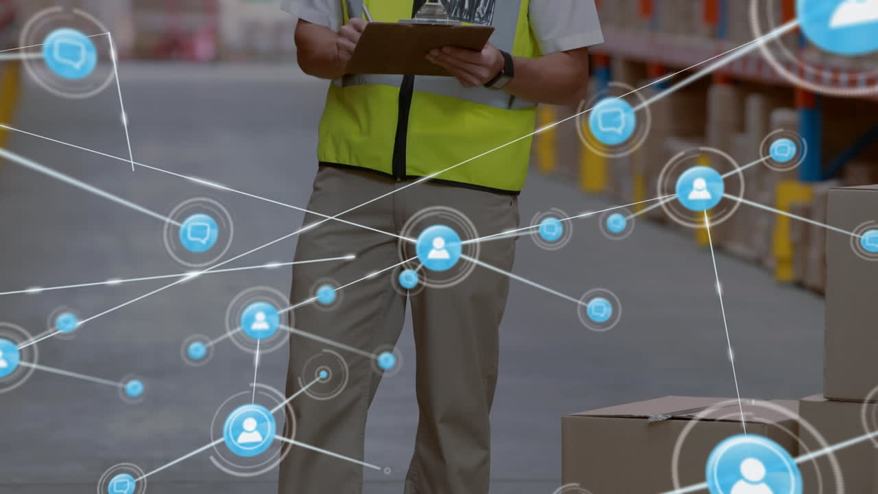 Animation of network of people icons over caucasian man working in warehouse writing on clipboard