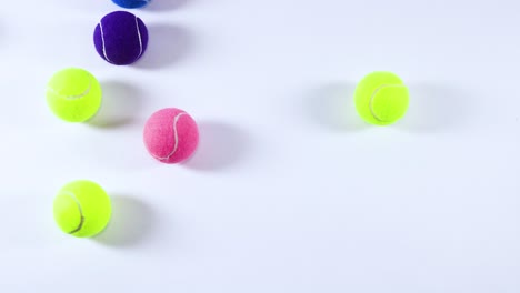 various colored balls moving across a surface
