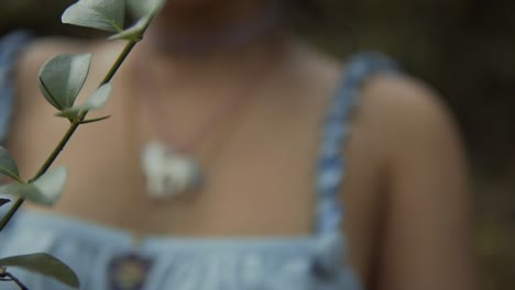 slow motion pan with of a woman's chest out of focus