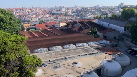 Along-the-banks-of-the-Douro-River,-the-enormous-wine-storage-tanks-of-the-Port-wine-cellar