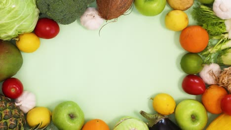 healthy food frame made of fresh and organic fruits and vegetables. stop motion flat lay