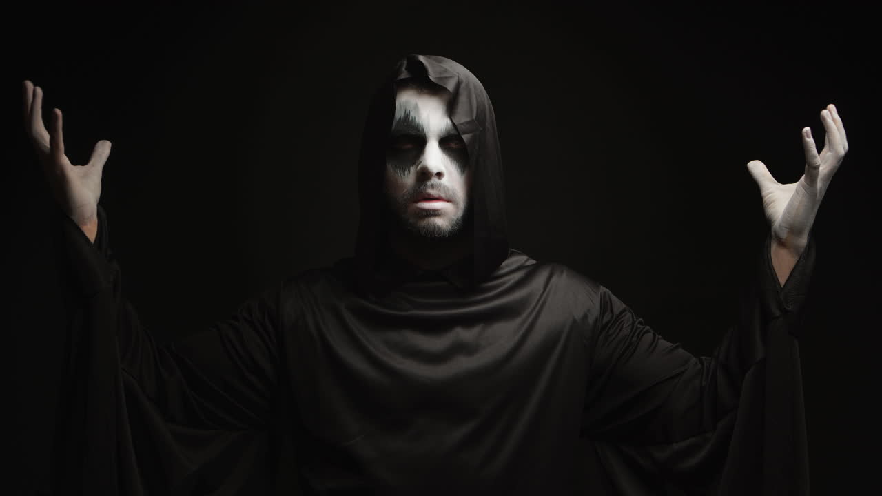 Young man dressed up as angel of darkness