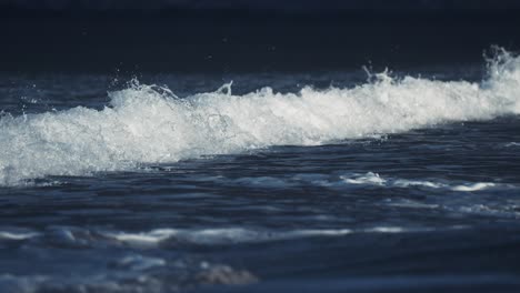 gentle waves roll on the sandy beach in ersfjord