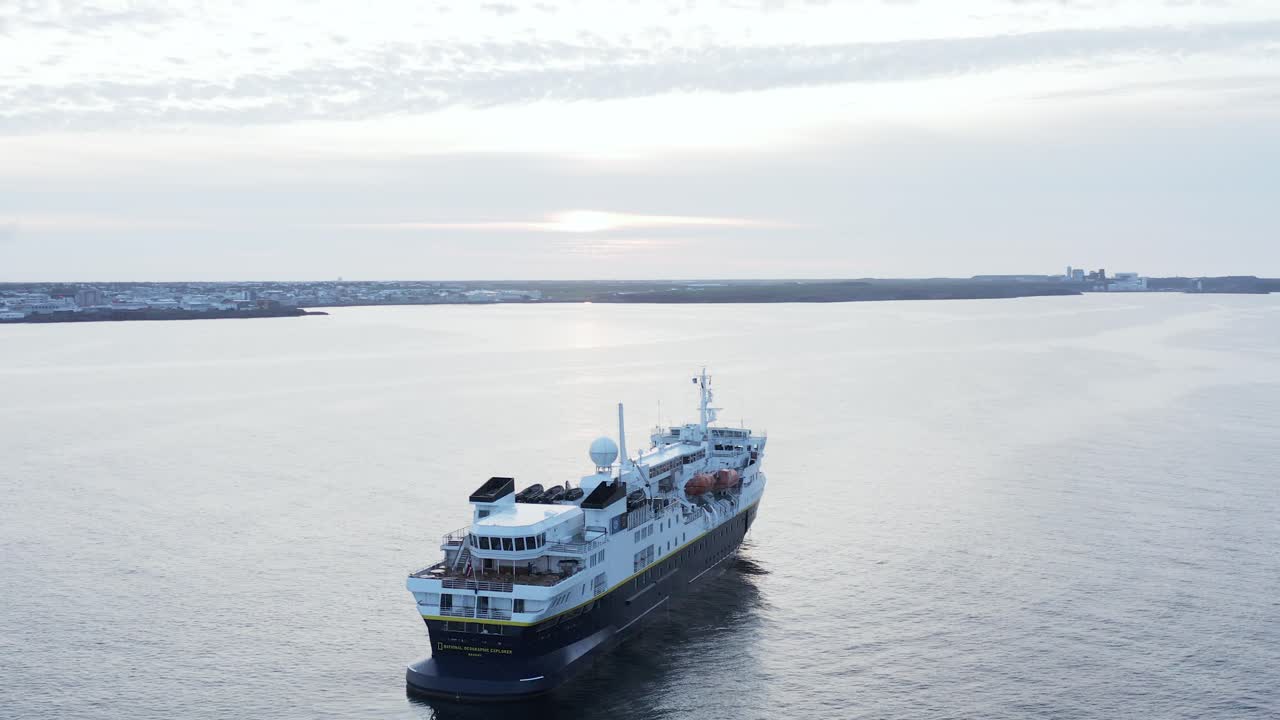 Expedition cruise ship of National Geographic anchored near Reykjavik peninsula, aerial