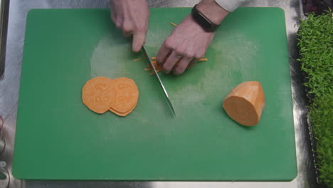 chef chopping sweet potato