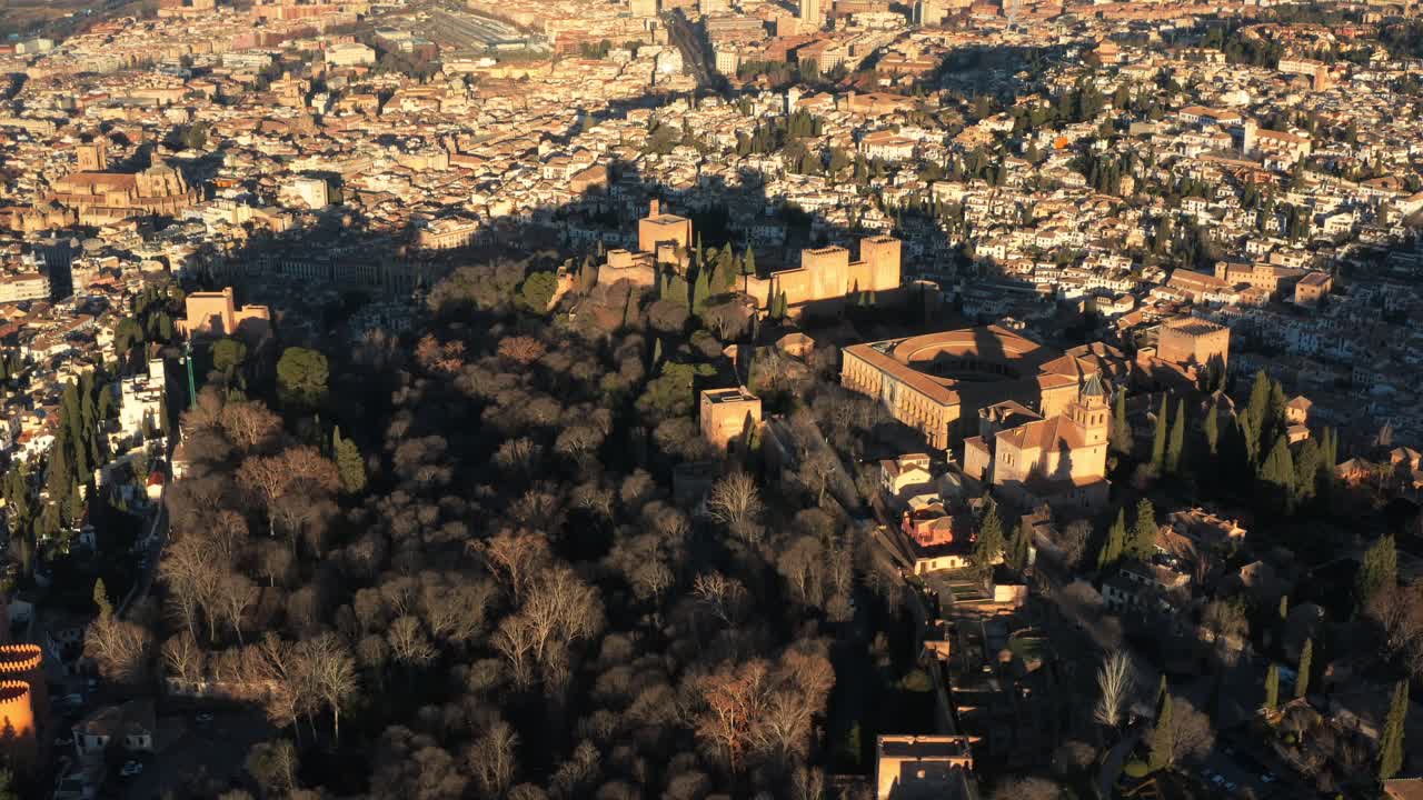 Aerial Drone view of historic Alhambra palace at sunset in Granada, Andalusia, Spain. The ancient Arabic fortress, Al andaluz