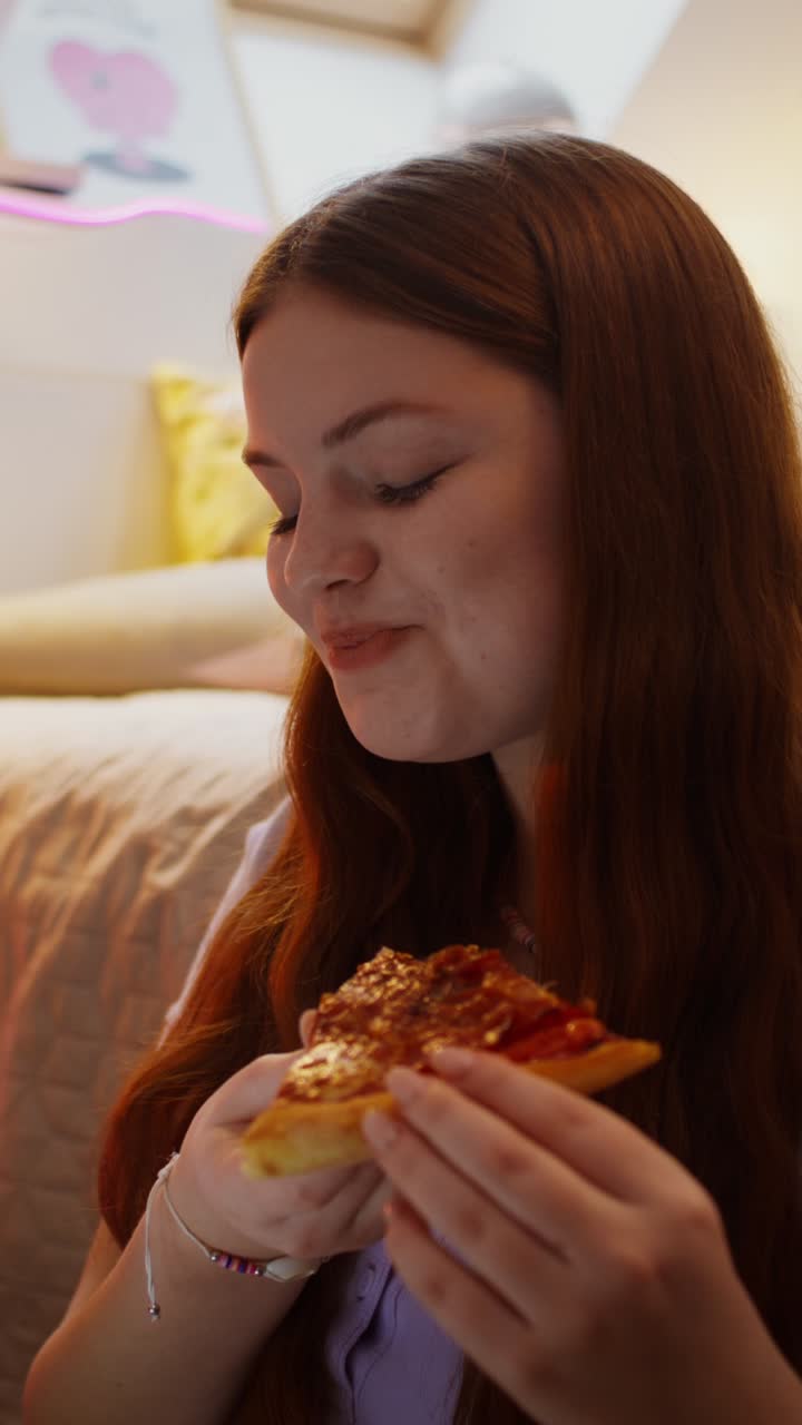 Teenage Girls Enjoying Pizza
