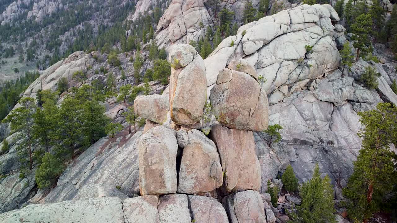 Aerial pan of Lumpy Ridge stacked rock formation, Estes Park, Colorado