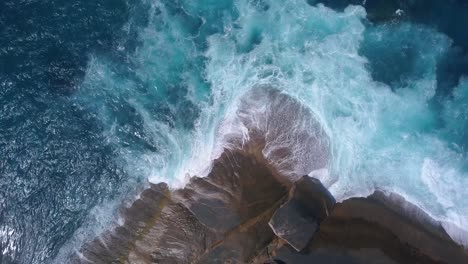 waves crashing against rocky australian coastline