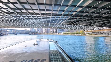 beautiful transition passing under a very low bidge, revealing blue sky city landscape in tokyo, japan