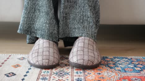 person wearing slippers and pajamas