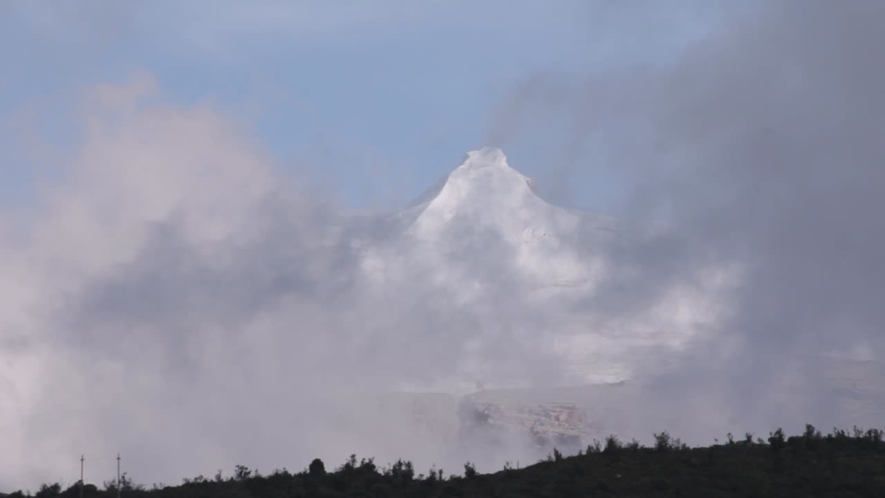 Mountain Peak Amidst Clouds