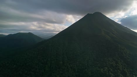 cerro chato volcano on cloudy day at sunset, la fortuna district in costa rica