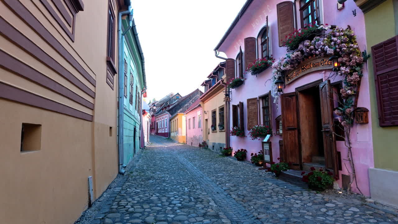 Charming street in Sighisoara with colorful homes and cobblestone road