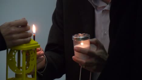 Close-up of people holding candles and lanterns for the transfer of Holy Fire at Easter in the Church of Holy Sepulchre in Jerusalem