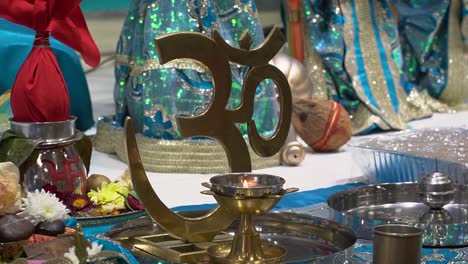 close up of om copper symbol at hindu temple 1