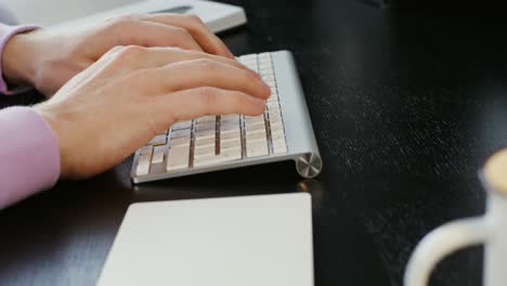 person typing on a keyboard